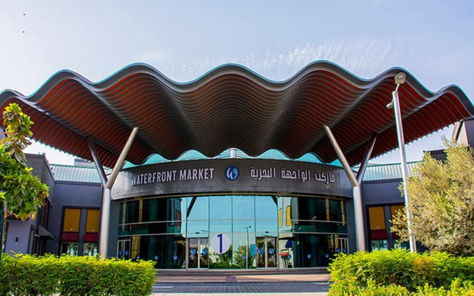Outdoor market with diverse vendors and cultural products